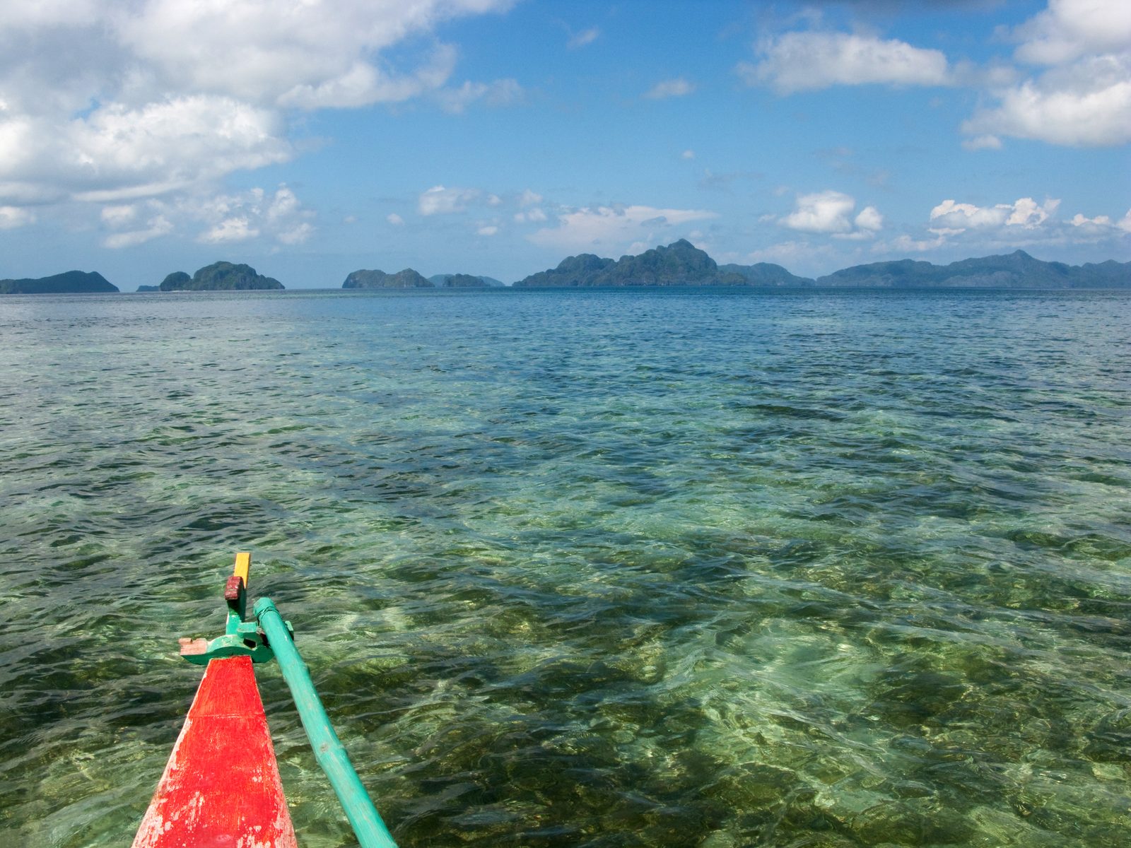 Traditional outrigger boat over clear water near El Nido, Palawan